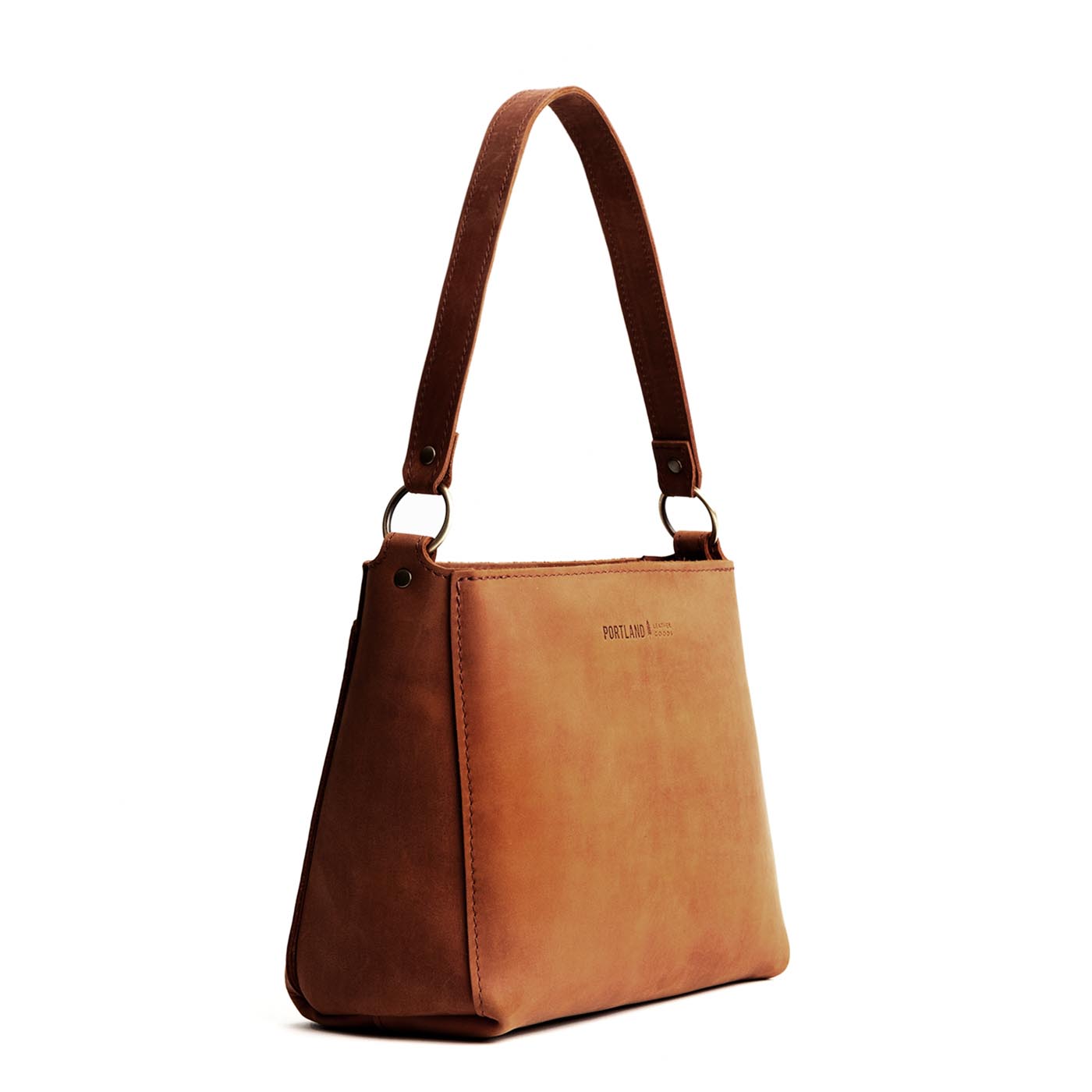 Dakota | Triangular shoulder bag with antiqued brass finished hardware