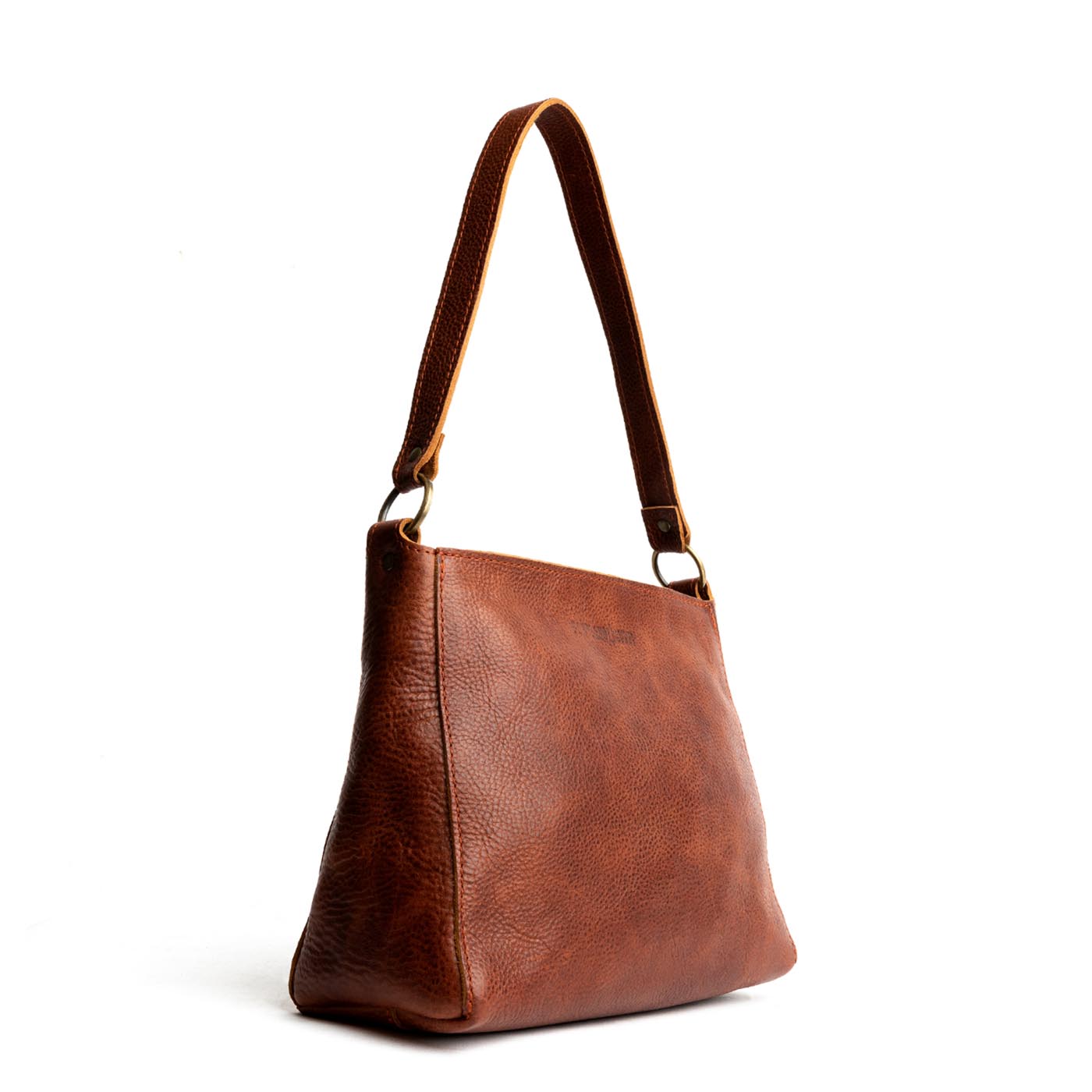 Nutmeg | Triangular shoulder bag with antiqued brass finished hardware