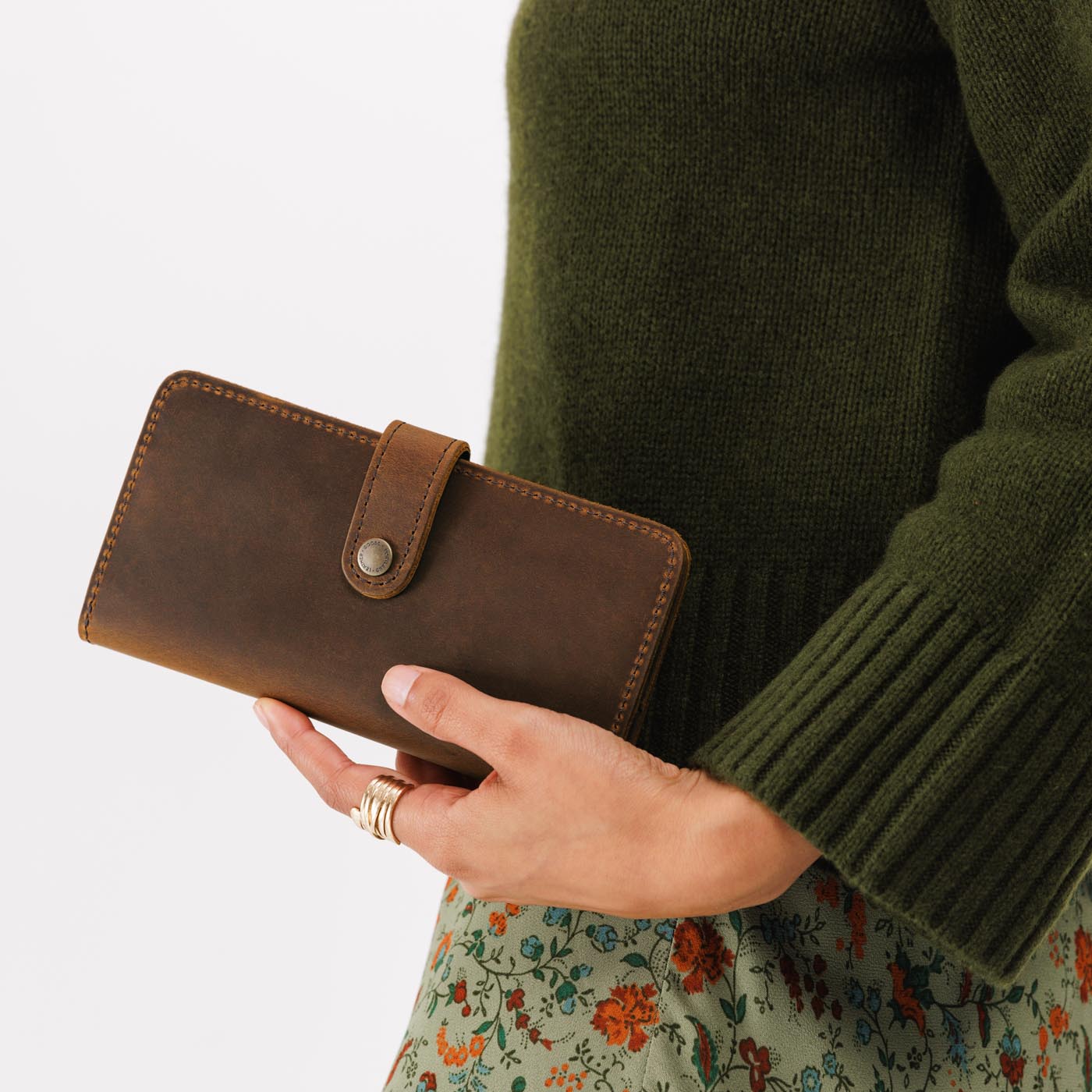 Canyon | Model holding leather wallet with snap closed