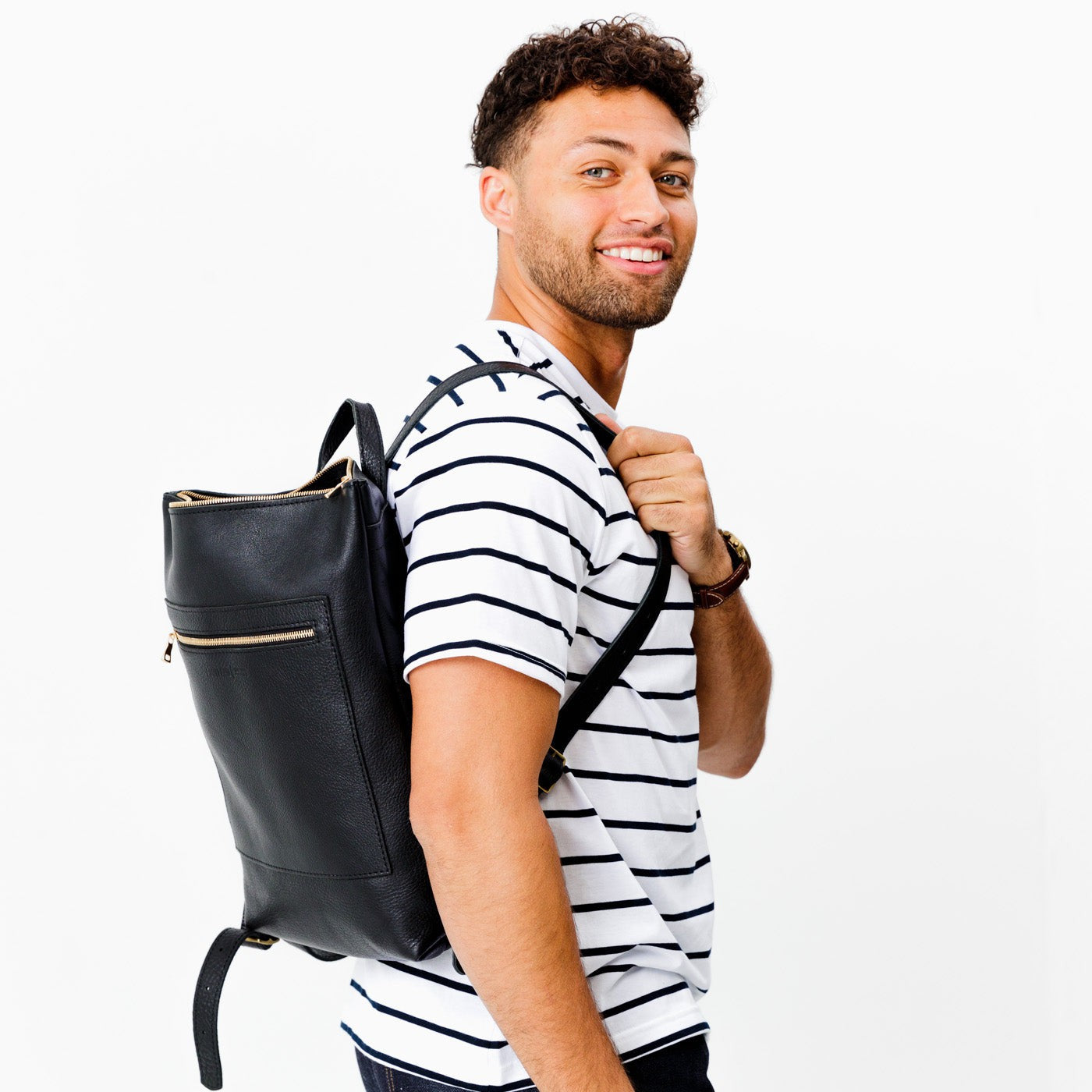 All Color: Pebbled--black | Model wearing rectangular slim leather laptop backpack