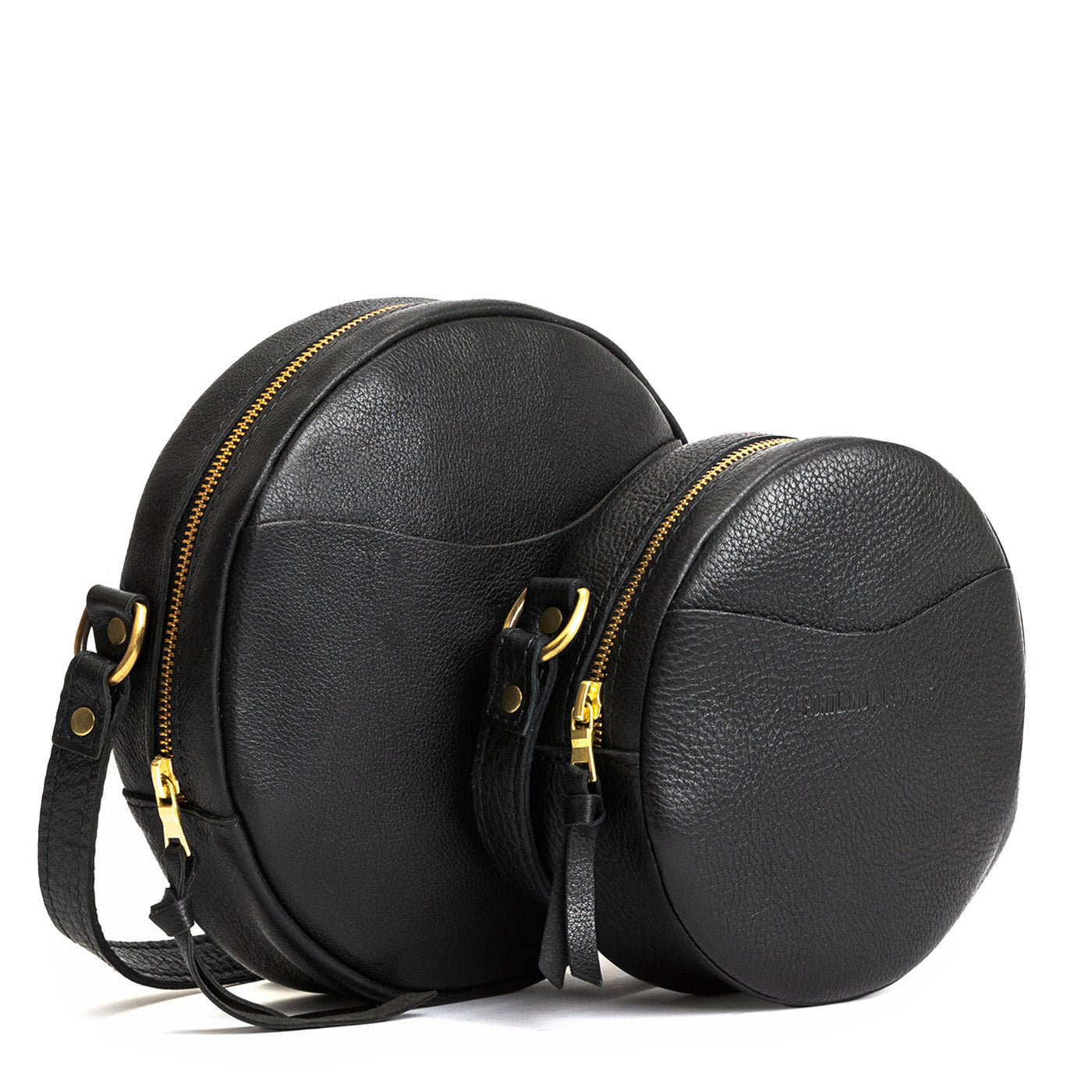 Pebbled--black | Circle shaped crossbody bag with top zipper