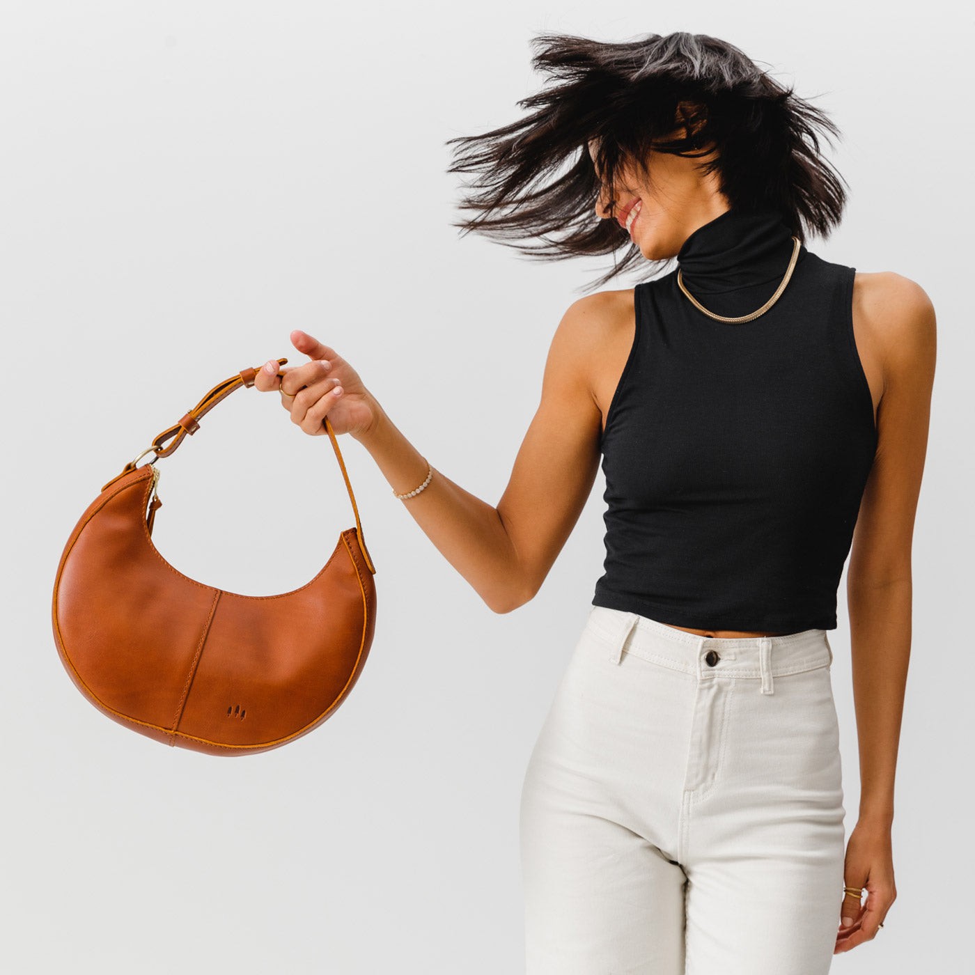 Honey*Classic | Crescent shaped shoulder bag with zipper closure and adjustable strap