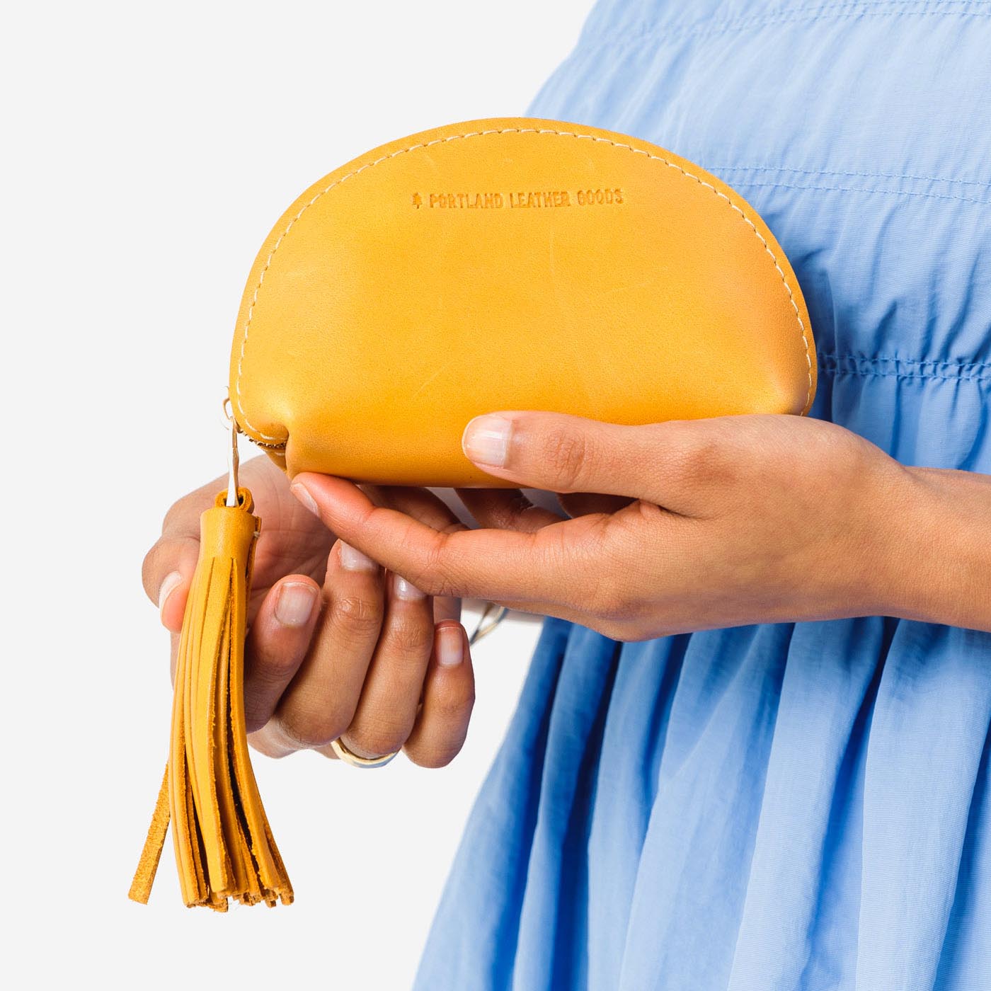 All Color: Sunflower | Small leather zippered pouch with tassel