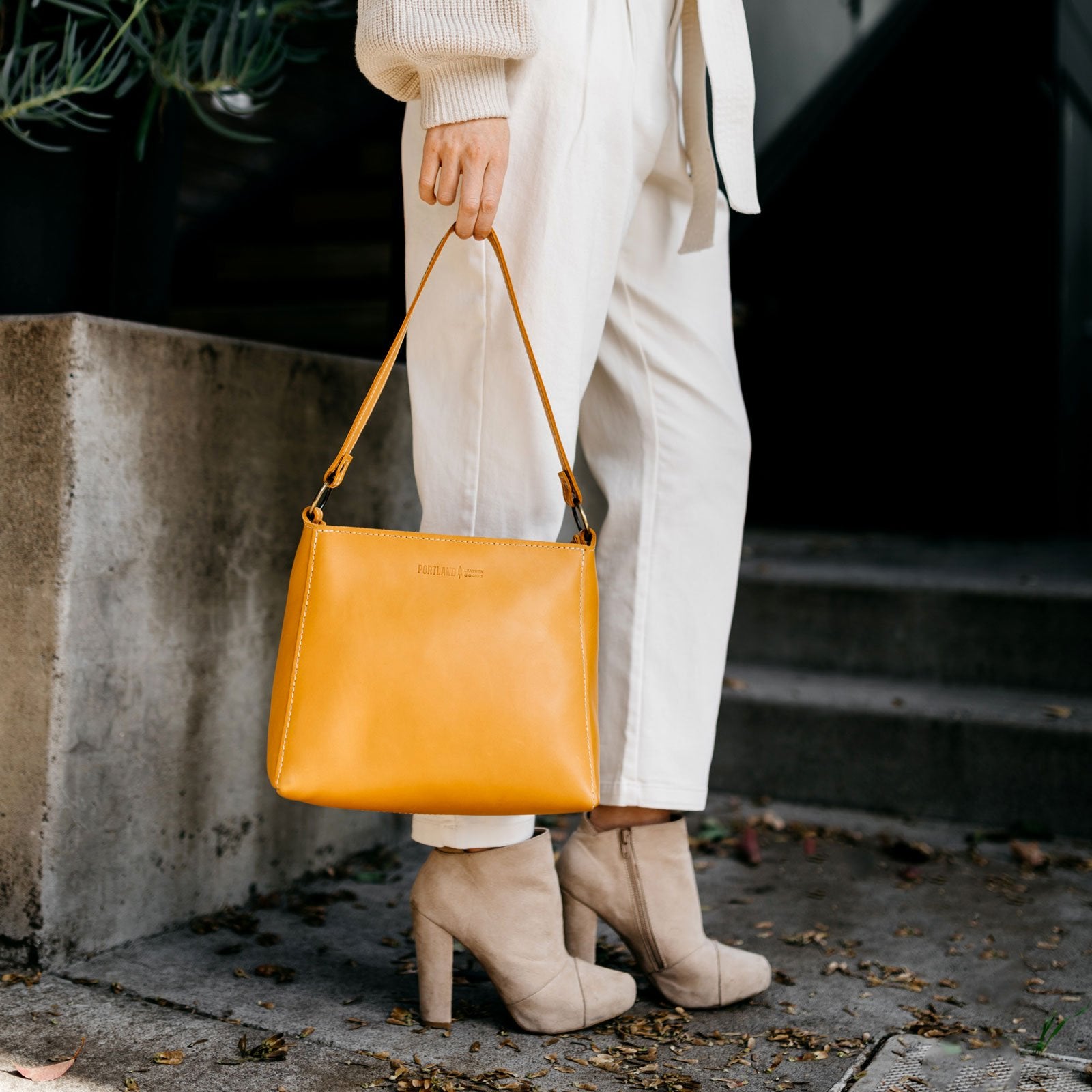 Sunflower | Triangular shoulder bag with antiqued brass finished hardware